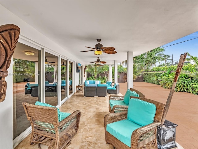 view of patio with outdoor lounge area and ceiling fan