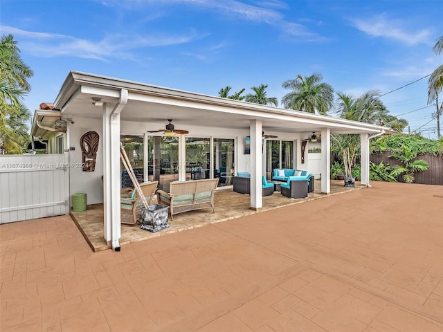 view of patio / terrace with ceiling fan and an outdoor living space