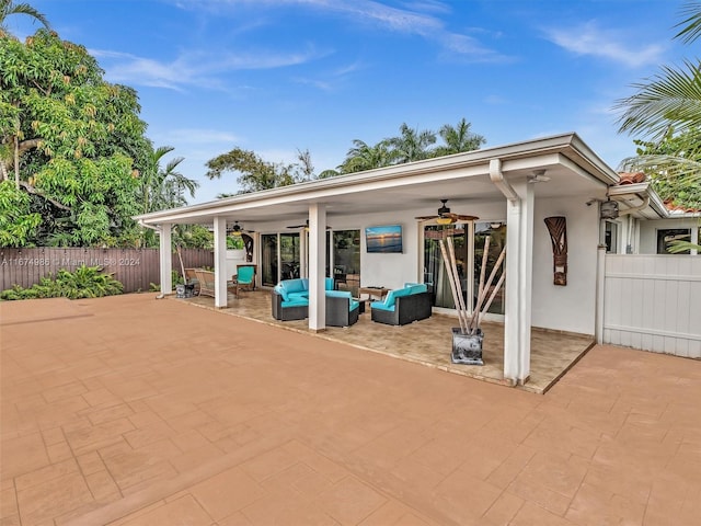 view of patio featuring outdoor lounge area and ceiling fan