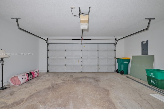 garage with electric panel and a garage door opener