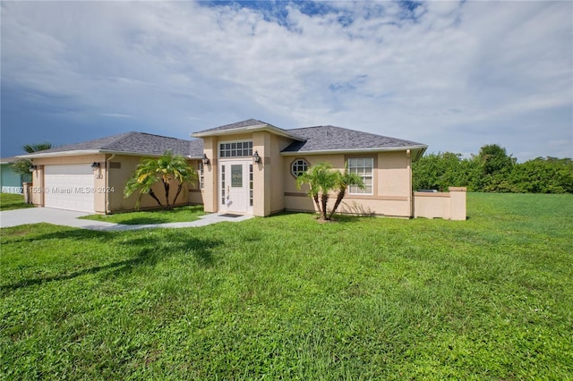13592 Clara Ln, Port Charlotte, FL 33981 - view of front facade featuring stucco siding, an attached garage, and a front yard