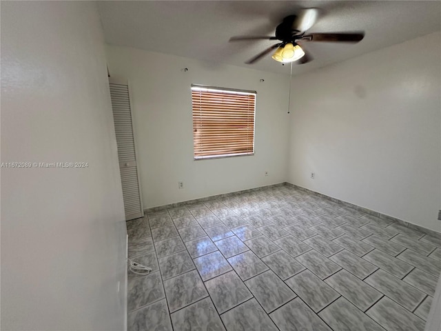 empty room featuring ceiling fan