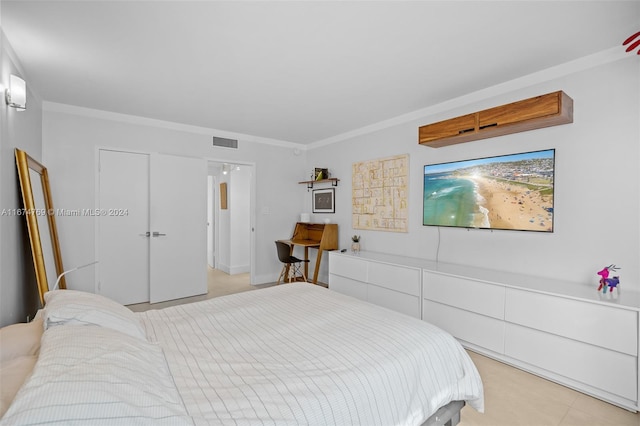 bedroom with crown molding and visible vents