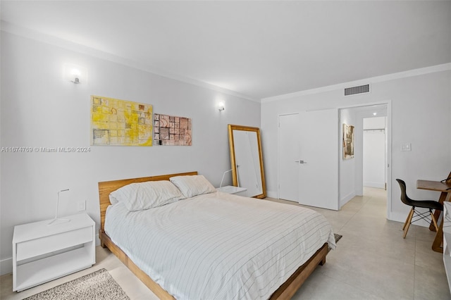 bedroom with ornamental molding