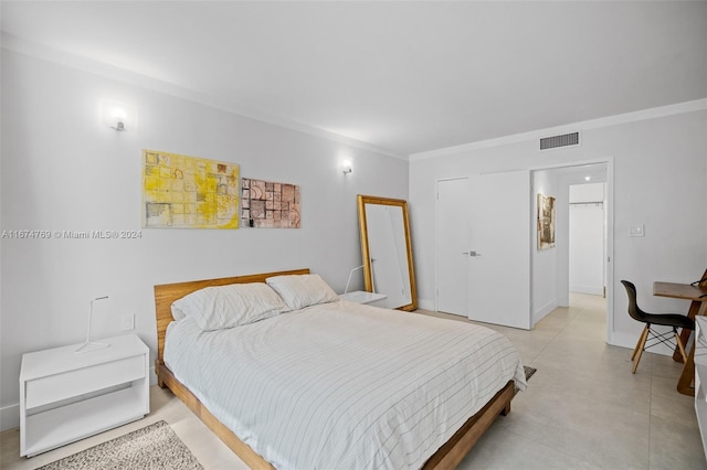 bedroom featuring visible vents and ornamental molding