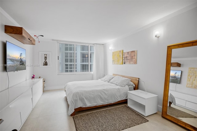 bedroom featuring light tile patterned flooring