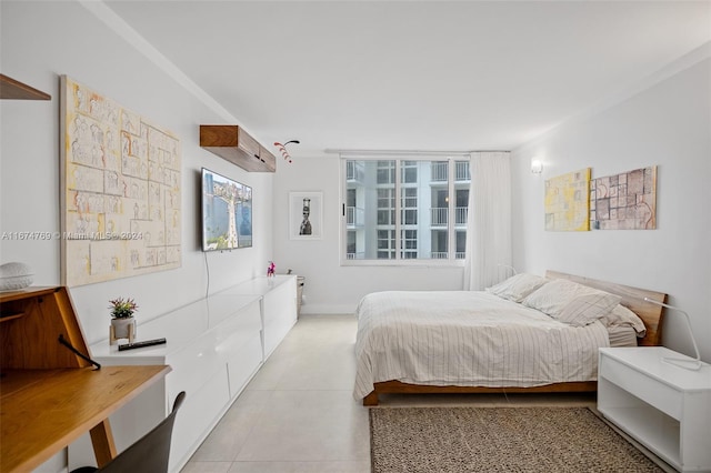 bedroom featuring light tile patterned flooring