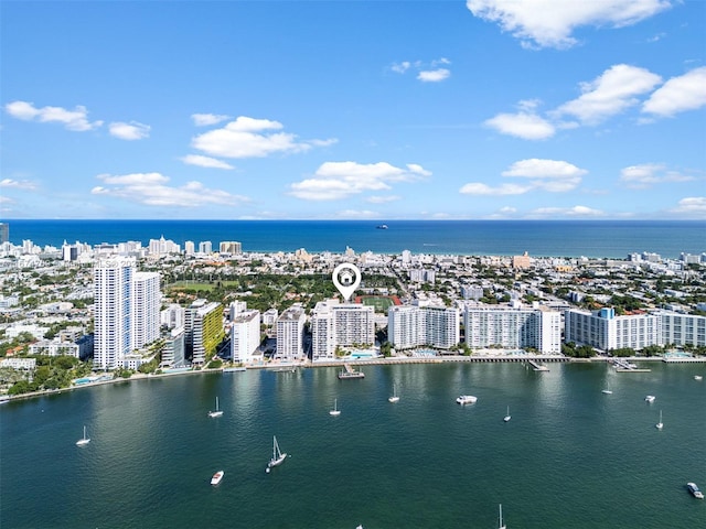bird's eye view featuring a water view and a view of city