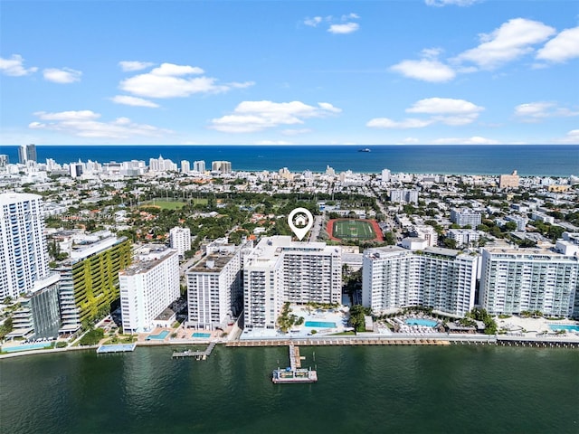 bird's eye view featuring a water view and a view of city