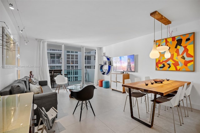 dining space featuring a wall of windows