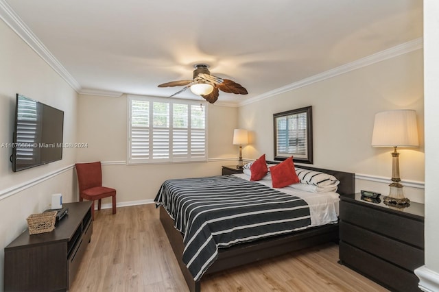 bedroom featuring ornamental molding, light hardwood / wood-style floors, and ceiling fan