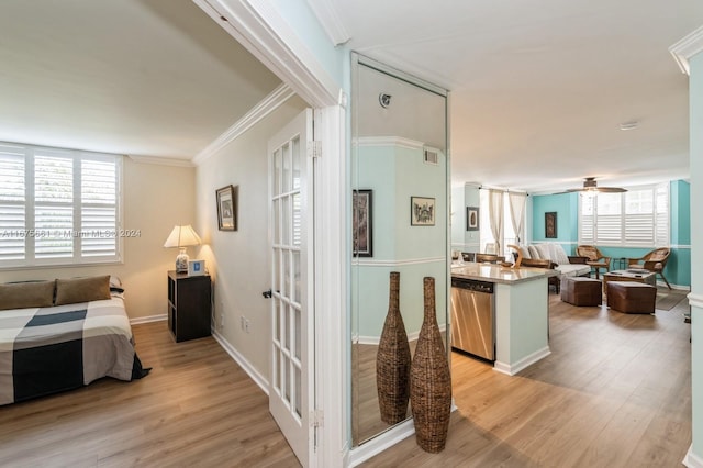 interior space with crown molding, light hardwood / wood-style flooring, and plenty of natural light