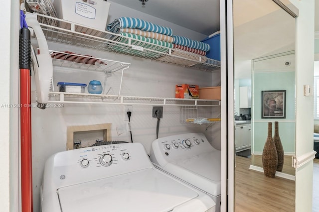 washroom featuring washer and dryer and hardwood / wood-style flooring