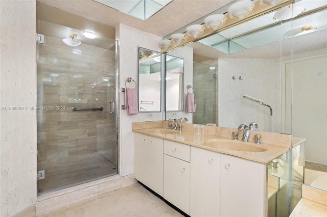 bathroom with walk in shower, a skylight, and vanity