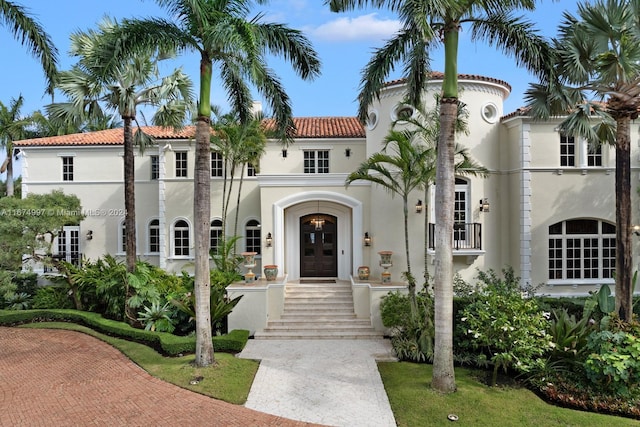 33 Arvida Pkwy, Coral Gables, FL 33156 - mediterranean / spanish-style home with stucco siding, french doors, and a tiled roof