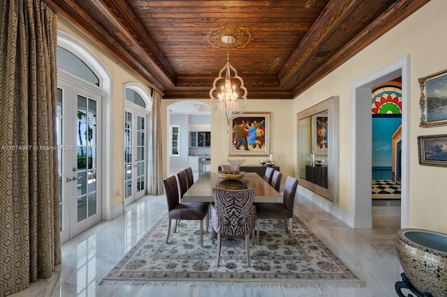 dining area featuring french doors, wood ceiling, crown molding, and an inviting chandelier