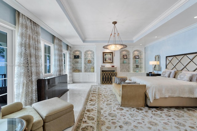 bedroom with crown molding and a raised ceiling