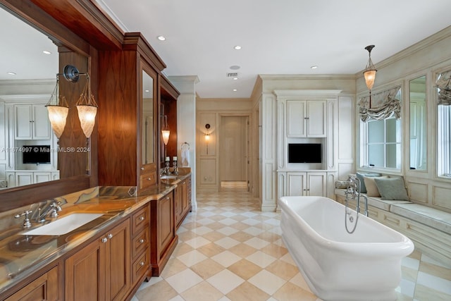 bathroom with vanity, ornamental molding, an inviting chandelier, and a bathing tub