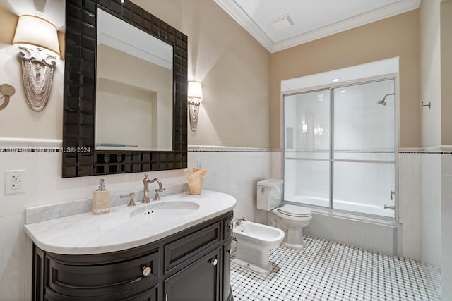 full bathroom with toilet, tile walls, bath / shower combo with glass door, vanity, and a bidet