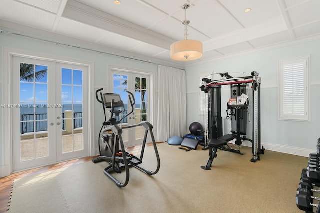 workout room featuring french doors, coffered ceiling, crown molding, and a wealth of natural light