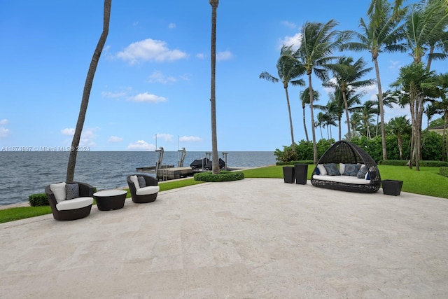 view of patio with a water view