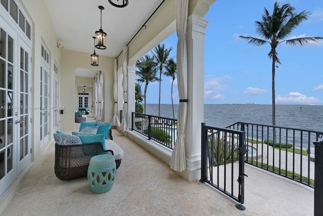 balcony featuring a water view