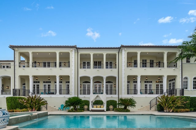 rear view of house with a balcony