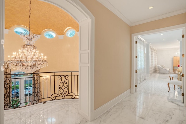 hall featuring an inviting chandelier and ornamental molding