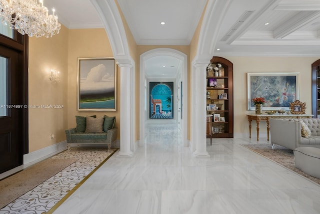 hallway featuring decorative columns, a notable chandelier, and crown molding