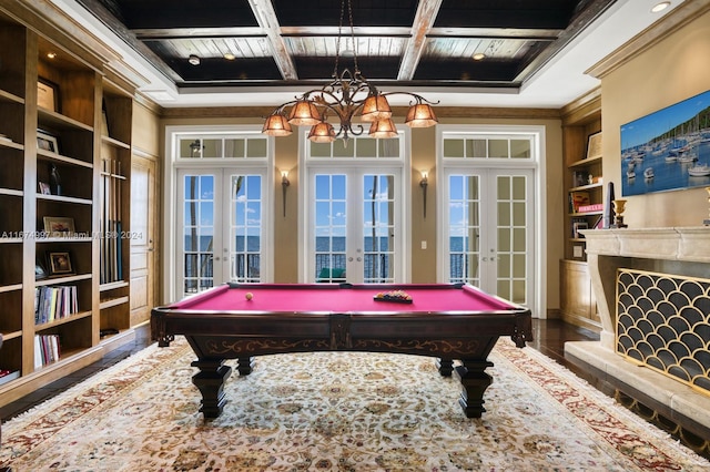 game room featuring french doors, hardwood / wood-style floors, coffered ceiling, beamed ceiling, and built in shelves