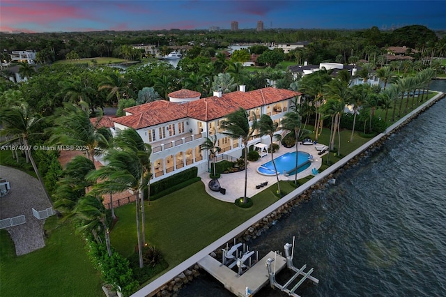 aerial view at dusk with a water view