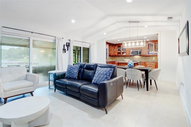 tiled living room with vaulted ceiling