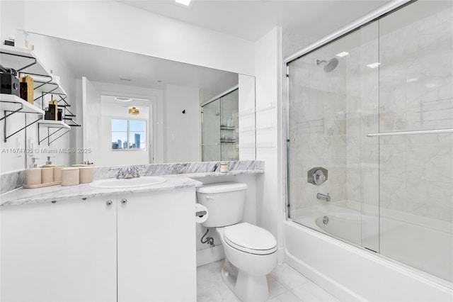 full bathroom with toilet, vanity, and shower / bath combination with glass door