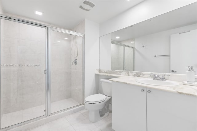 bathroom featuring toilet, vanity, an enclosed shower, and tile patterned flooring