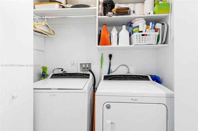 washroom with washing machine and clothes dryer