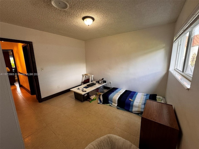 bedroom featuring a textured ceiling