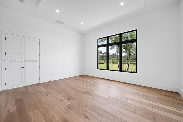 unfurnished room with light hardwood / wood-style floors