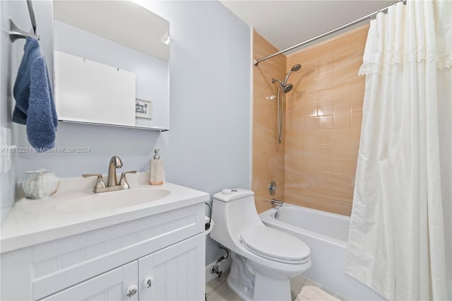 full bathroom with shower / tub combo with curtain, vanity, and toilet