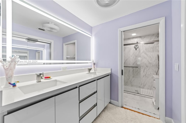 bathroom with a shower with door and vanity