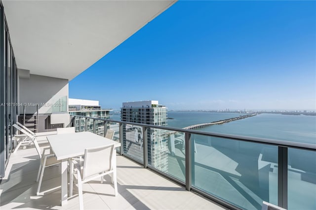 balcony featuring a water view