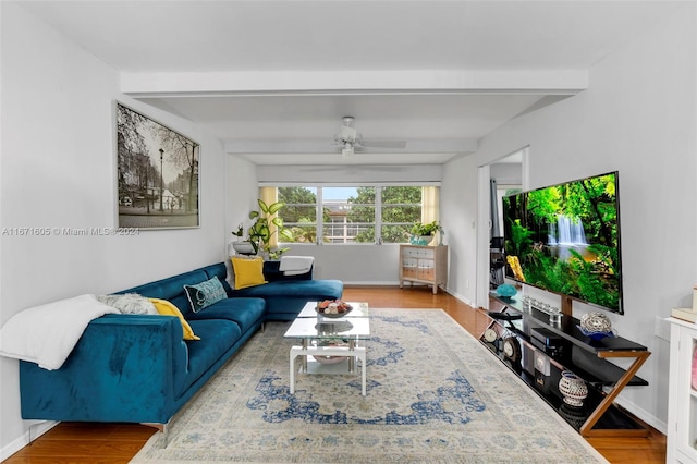 living room with beamed ceiling, ceiling fan, and wood-type flooring