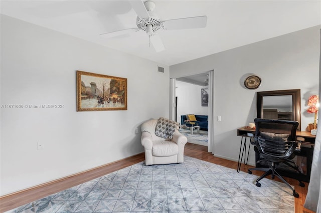 office featuring light wood-type flooring and ceiling fan