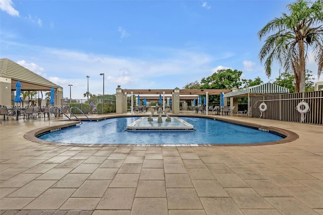 view of pool with a patio and a pergola