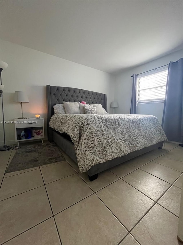 bedroom featuring tile patterned flooring