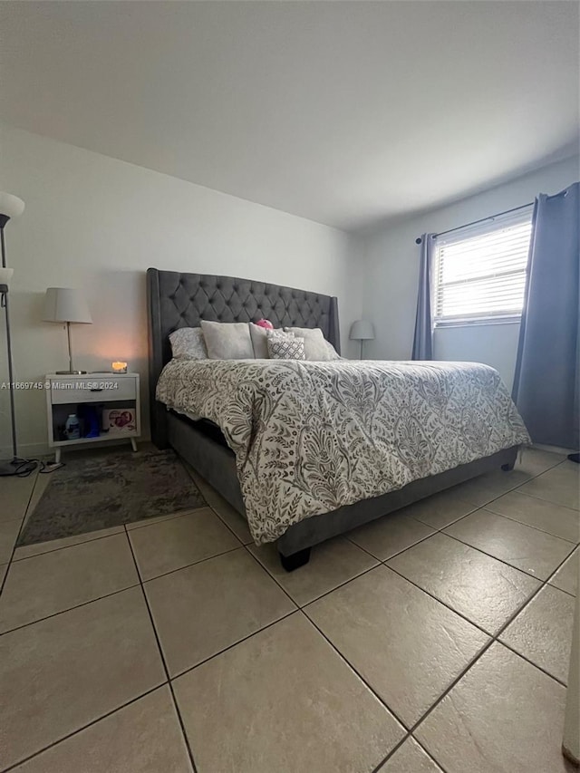 8075 NW 7th St Unit 109, Miami, FL 33126 - bedroom with tile patterned floors