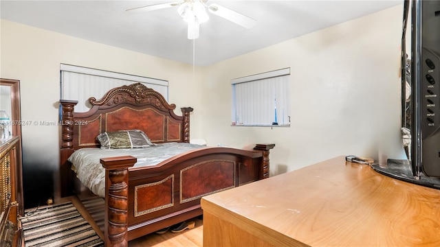 bedroom with ceiling fan and wood-type flooring