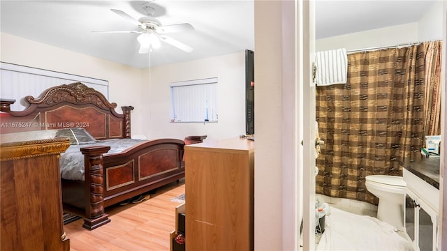 bedroom featuring wood-type flooring and ceiling fan