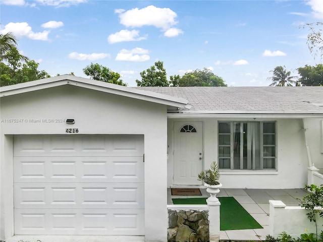 single story home featuring a garage