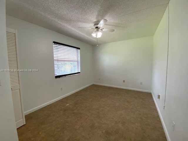 2629 SE 19th Ct Unit 103-C, Homestead, FL 33035 - interior space with tile patterned floors, a ceiling fan, baseboards, and a textured ceiling
