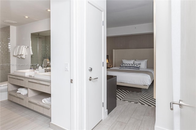 bathroom featuring vanity and a shower